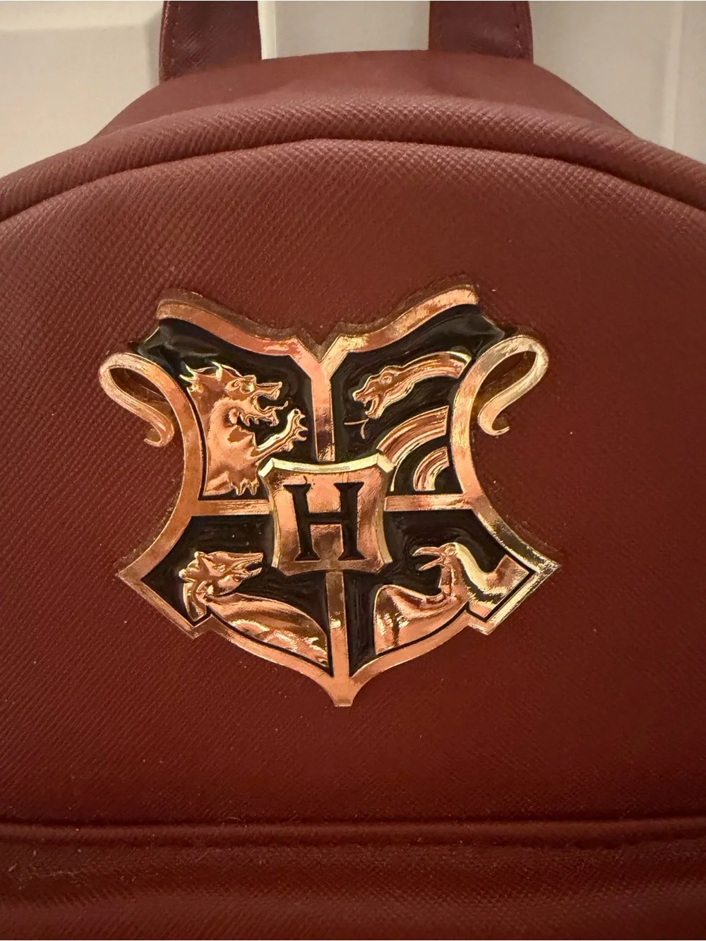Harry Potter Burgundy Backpack with Gold Logo Crest in Center